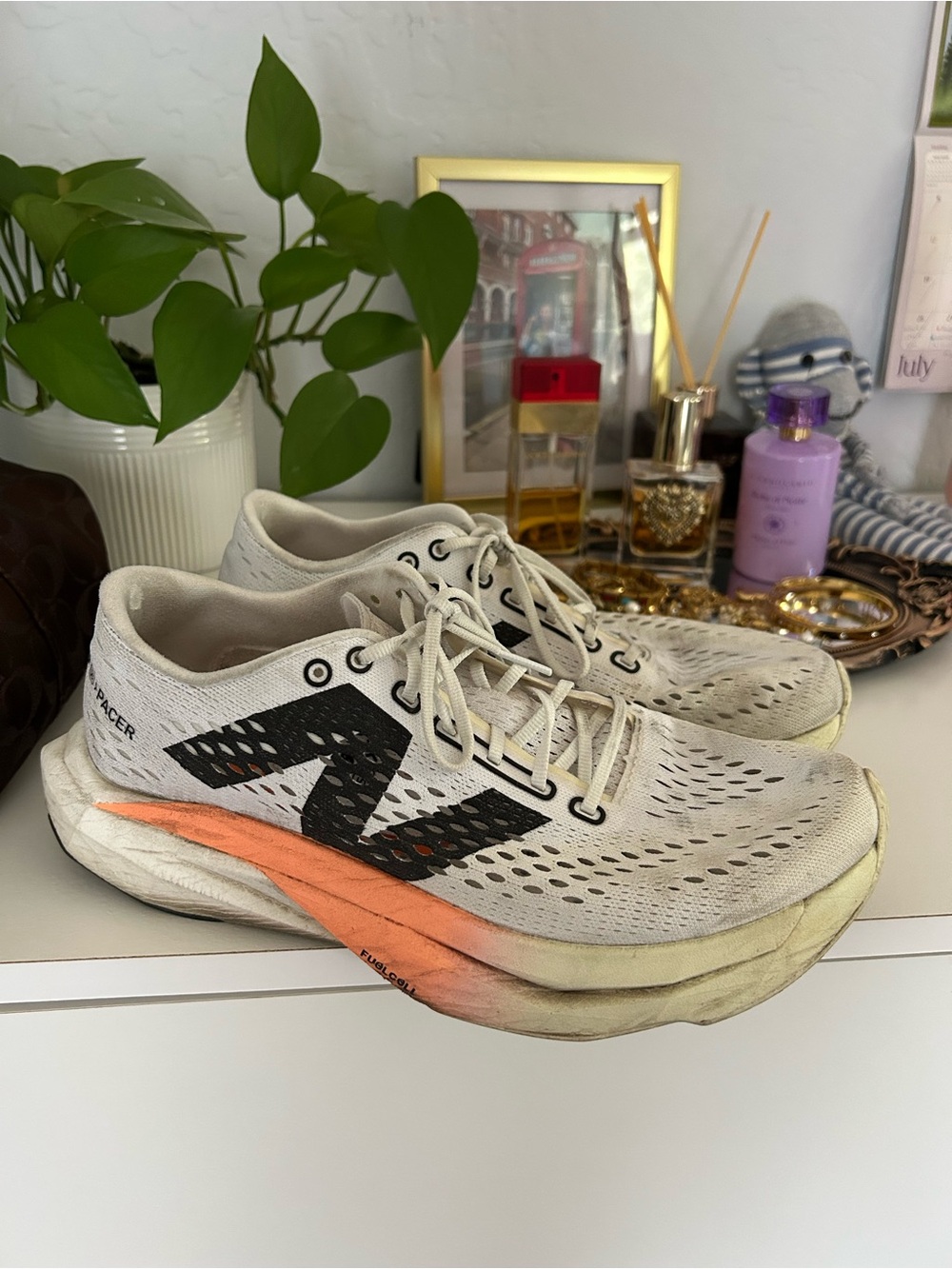 New Balance Women's White and Black Running Shoes with Orange Accent